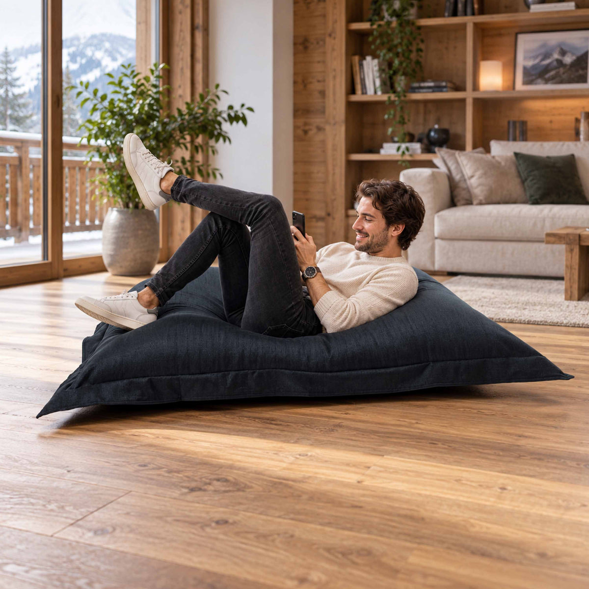 Pouf Lin Noir cocooning intérieur 170x130 cm en lin, assise détente dans un salon chaleureux