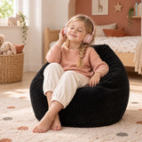 Pouf Poire Enfant Velours Côtelé Noir : enfant lisant et écoutant de la musique sur un pouf poire velours côtelé enfant